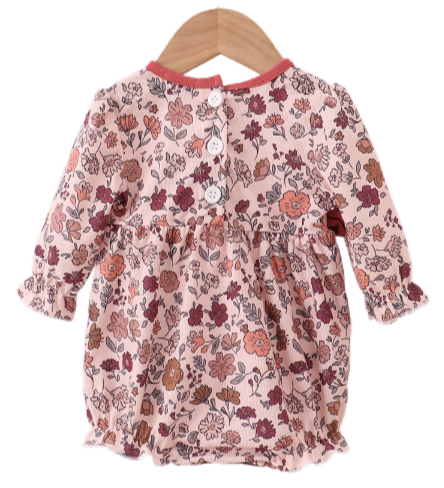 Two baby girl autumn outfits in soft corduroy with warm floral prints. One is a romper with ribbon details, and the other is a pants and top set, both in matching fall tones.